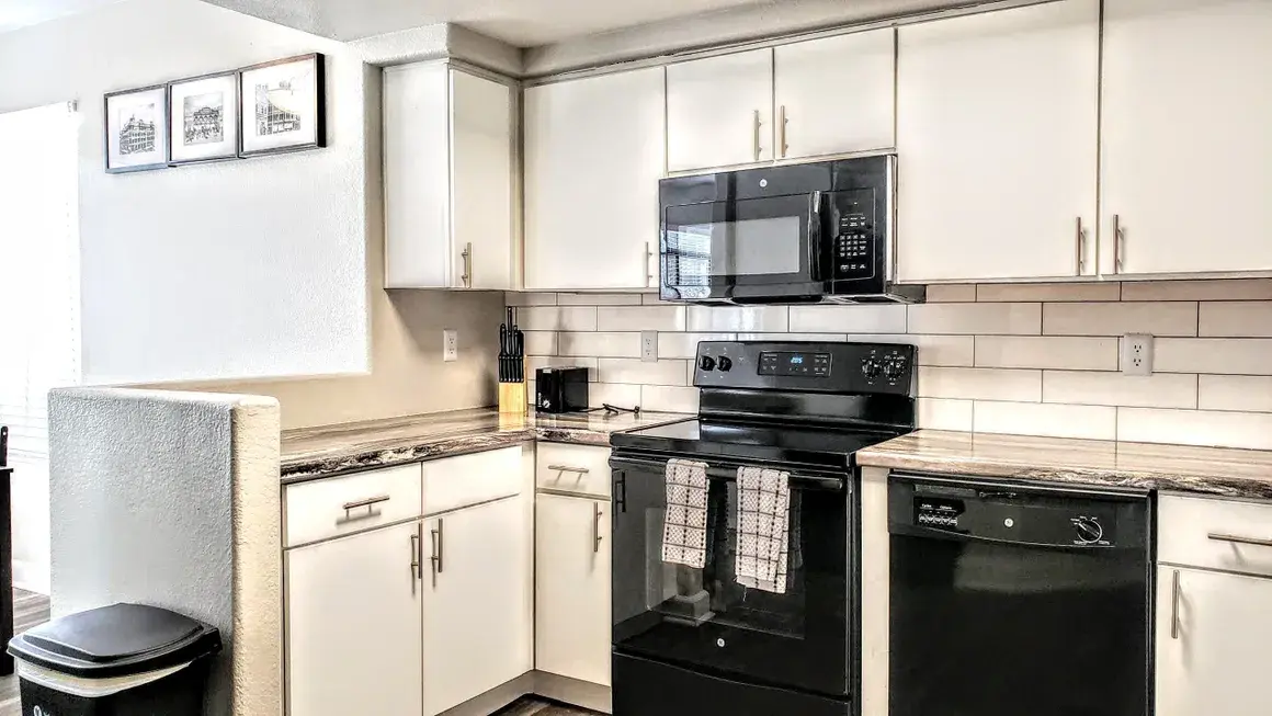 Fully equipped kitchen — pots, pans, and dishes included in every unit